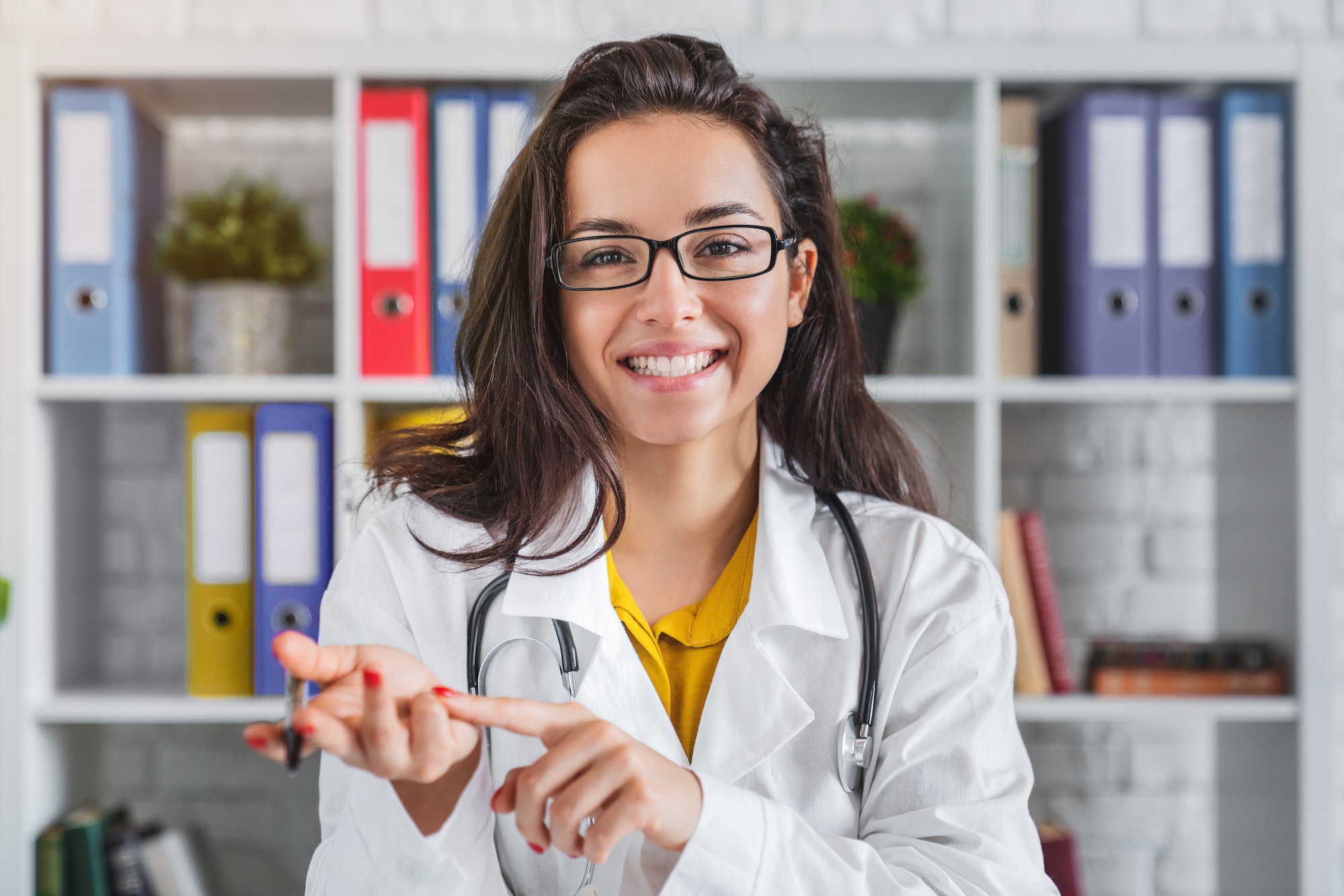 Webcam view of female doctor physician talking using video call app consultation.