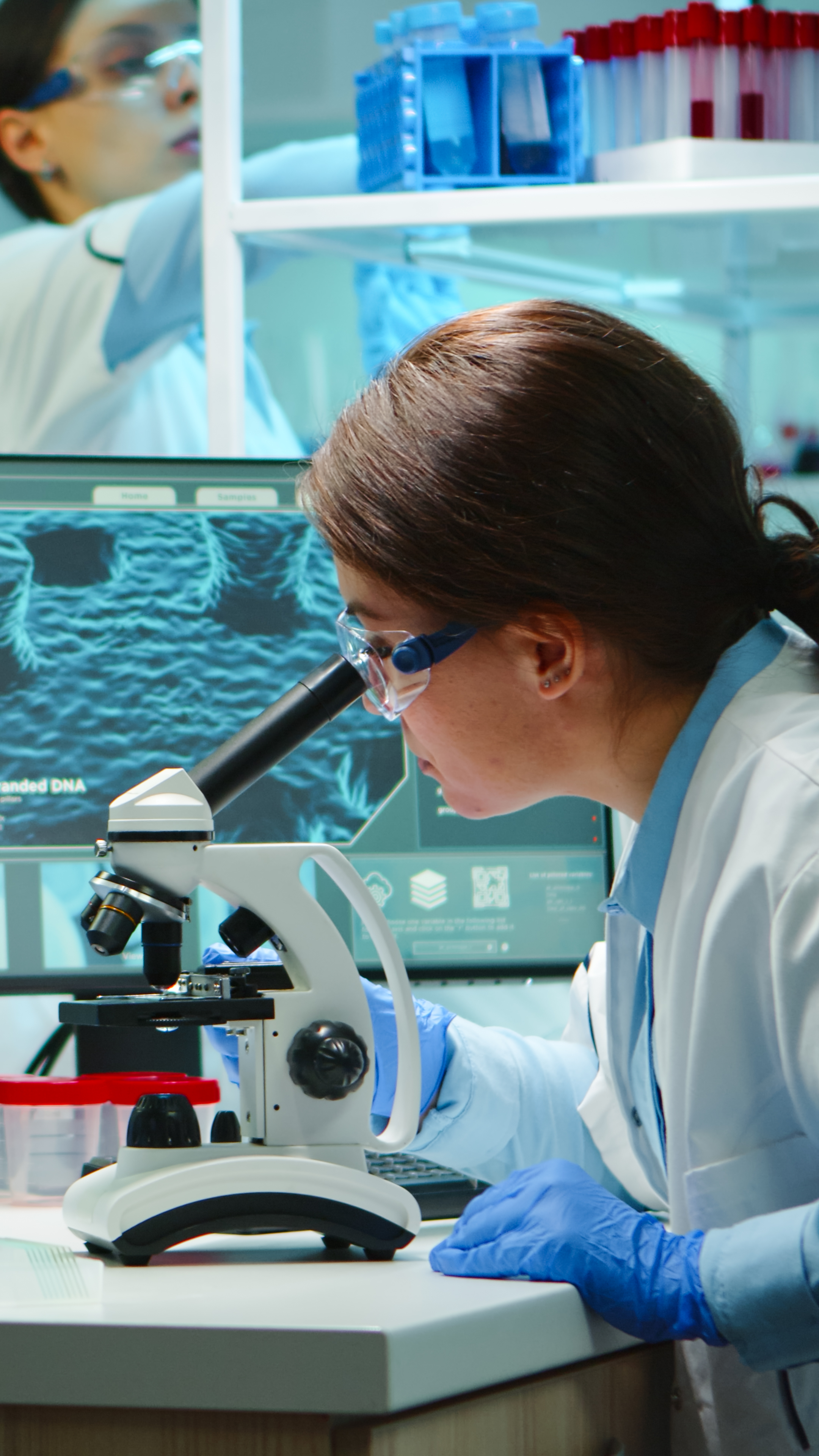 Microbiologist working late at night for new vaccine